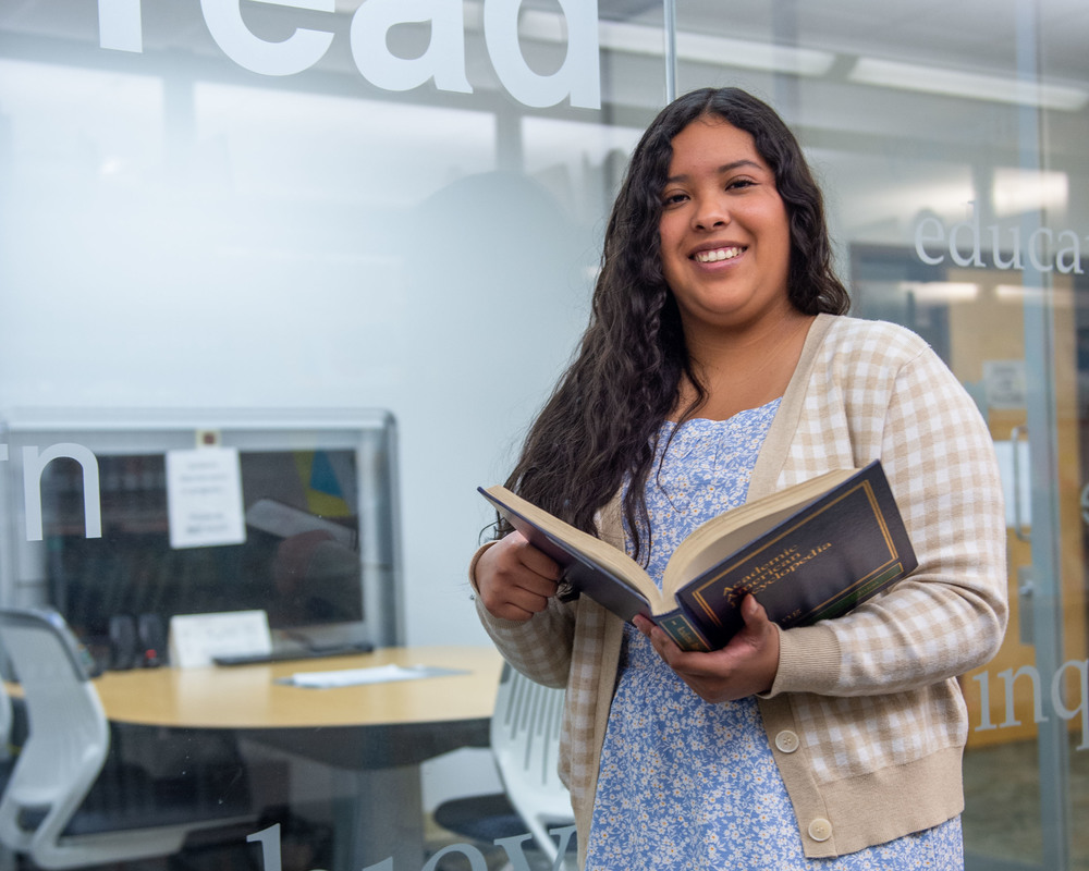 Student holding a book