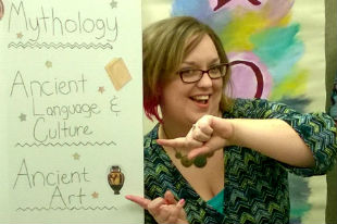 Jessica Leonard with poster that reads Mythology, Ancient Langue and Culture, Ancient Art