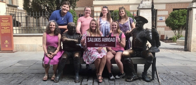 Students holding sign that reads Salukis Abroad