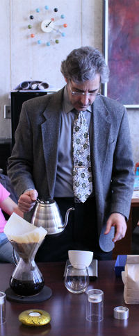 Dr. Steinbock pouring coffee