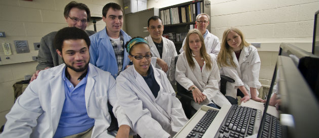 researchers gathered in lab